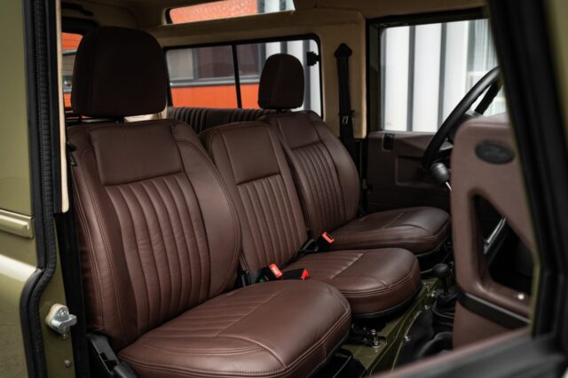 The cabin of a vehicle sets the tone for the driving experience, and the stage for memories to be made.Step inside this build and you’re met with a beautifully simple, but purposeful interior that has defined the Defender since its inception. Upright seating, no-nonsense function, and the unmistakable and uncommon centre seat that enables this little truck to seat 7 - All reminders that the Defender was built as a working tool long before it became a collectible icon.This particular example remains remarkably preserved, yet subtly elevated with a gentleman’s touch of equestrian-style  refinement. Fluted chocolate leather is complemented with matching pulls and door handles. A limestone beige Alcantara headliner brings brightness to the cabin while nodding back to the simplicity of earlier Series models.We think the balance is just right, but we’ll let you decide.There are no touchscreens here. No driver modes. Just the unmistakable feel of a classic Defender exactly as God intended.📍Located in Connecticut, USA
📩 sales@podsoverland.com🌍 www.podsoverland.com#landroverdefender #defender90 #defender300tdi #landroverclassic #classicdefender